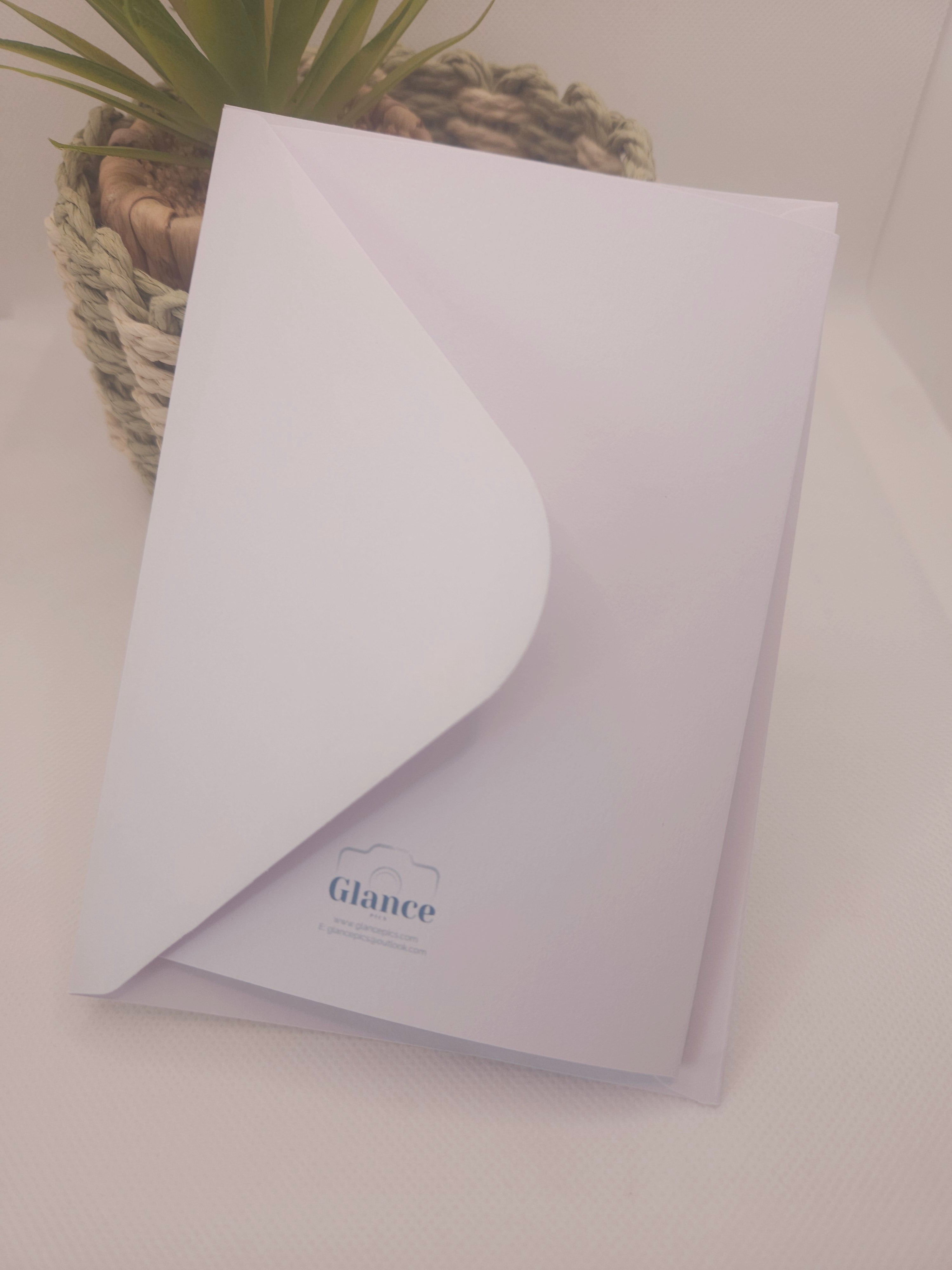 plain back of a white greeting card with glance pics logo