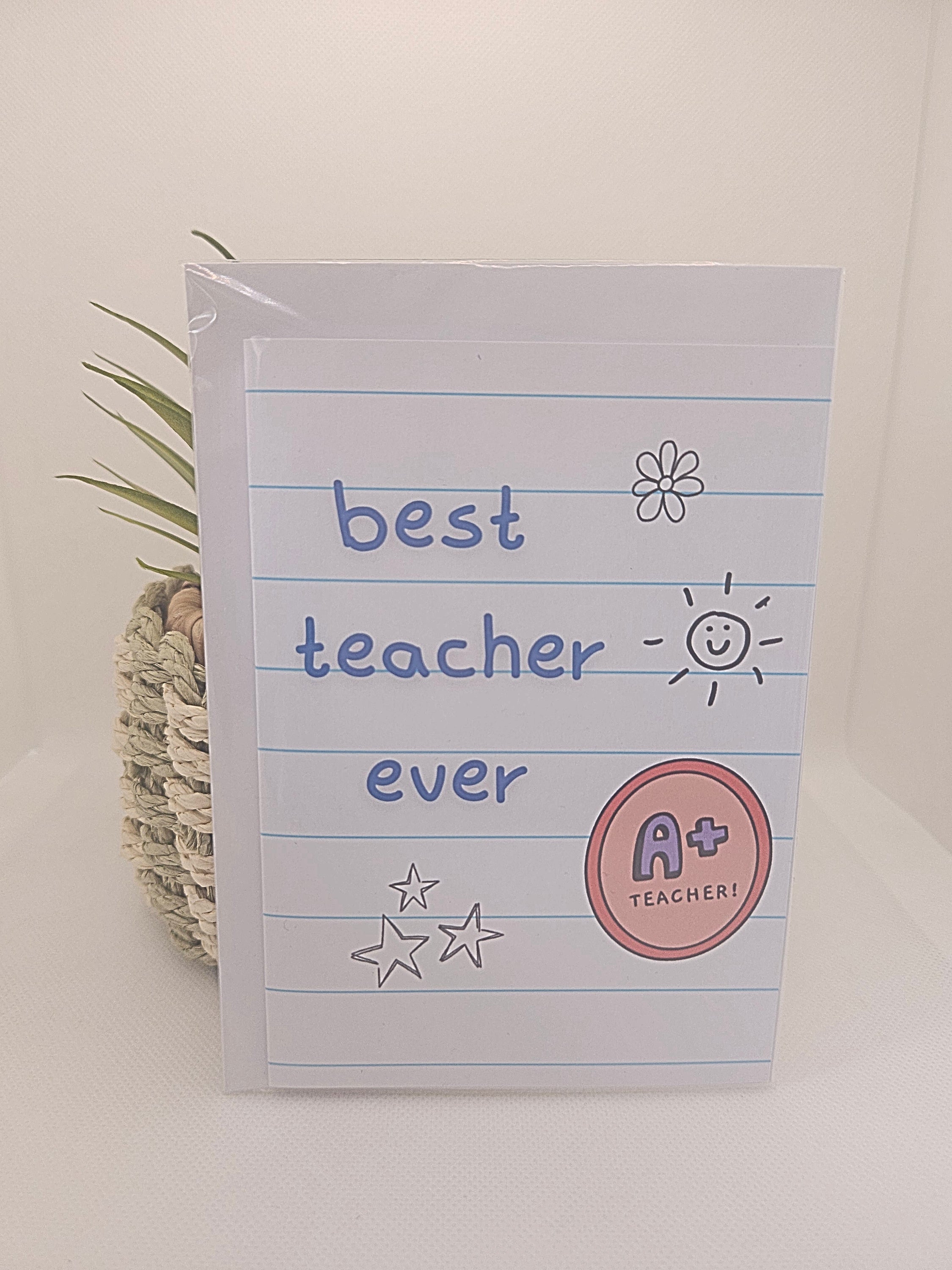 Card with 'best teacher ever' text and decorative elements on a light background