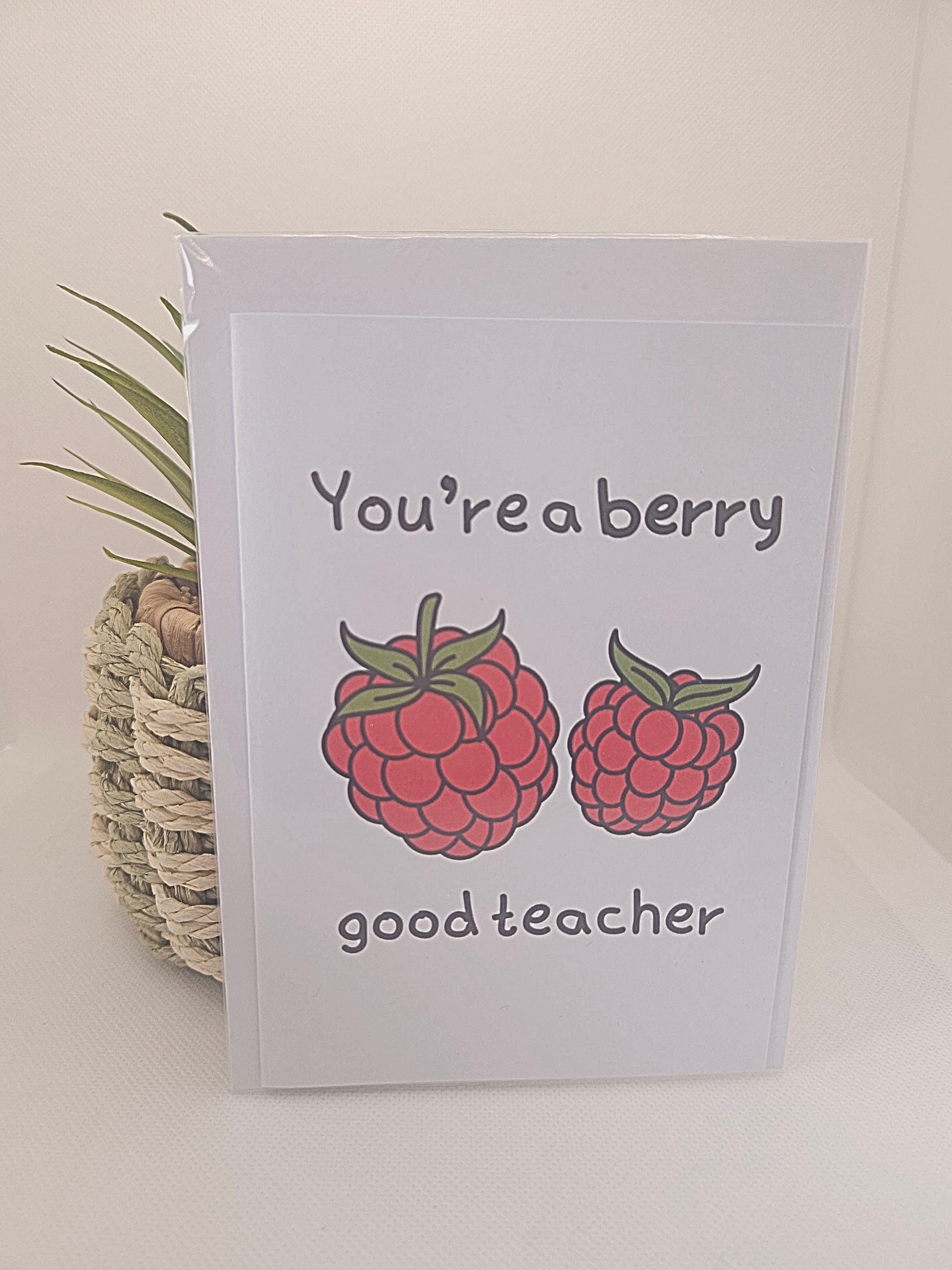 Card with raspberries and text 'You're a berry good teacher' on a light background