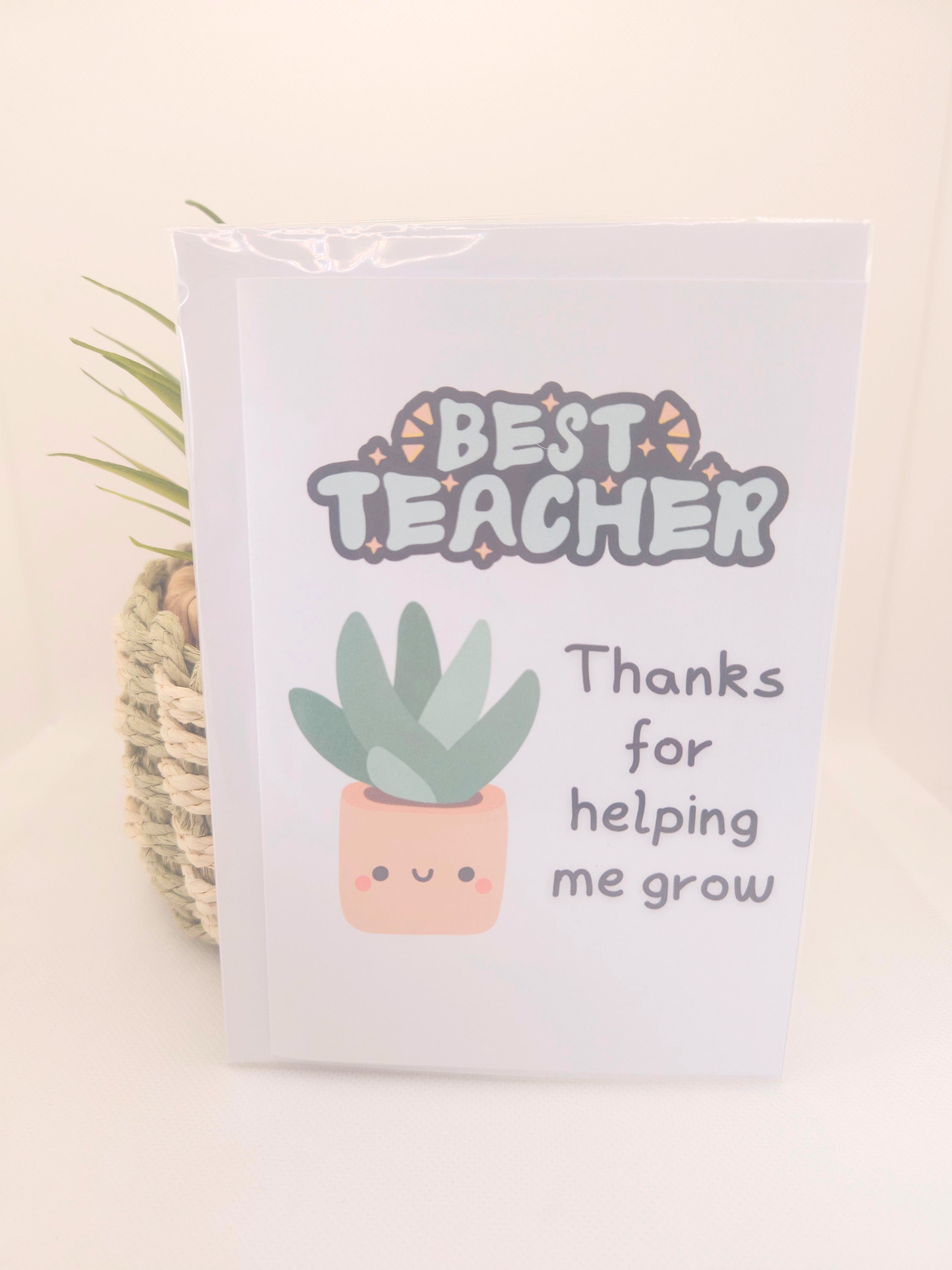 Card with 'Best Teacher' text and a plant illustration on a beige background