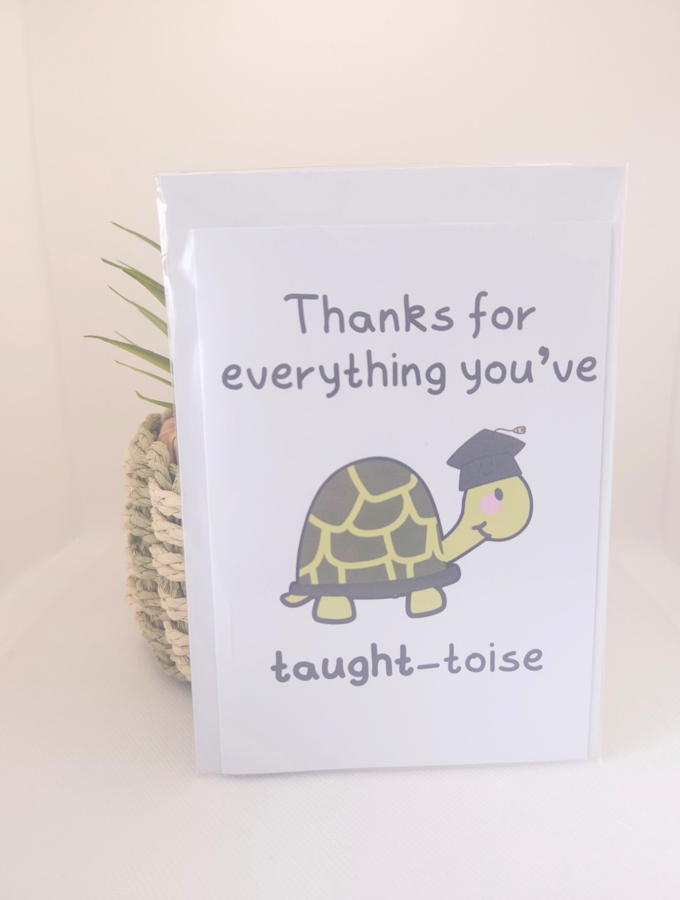 Card with a turtle illustration and text on a beige background