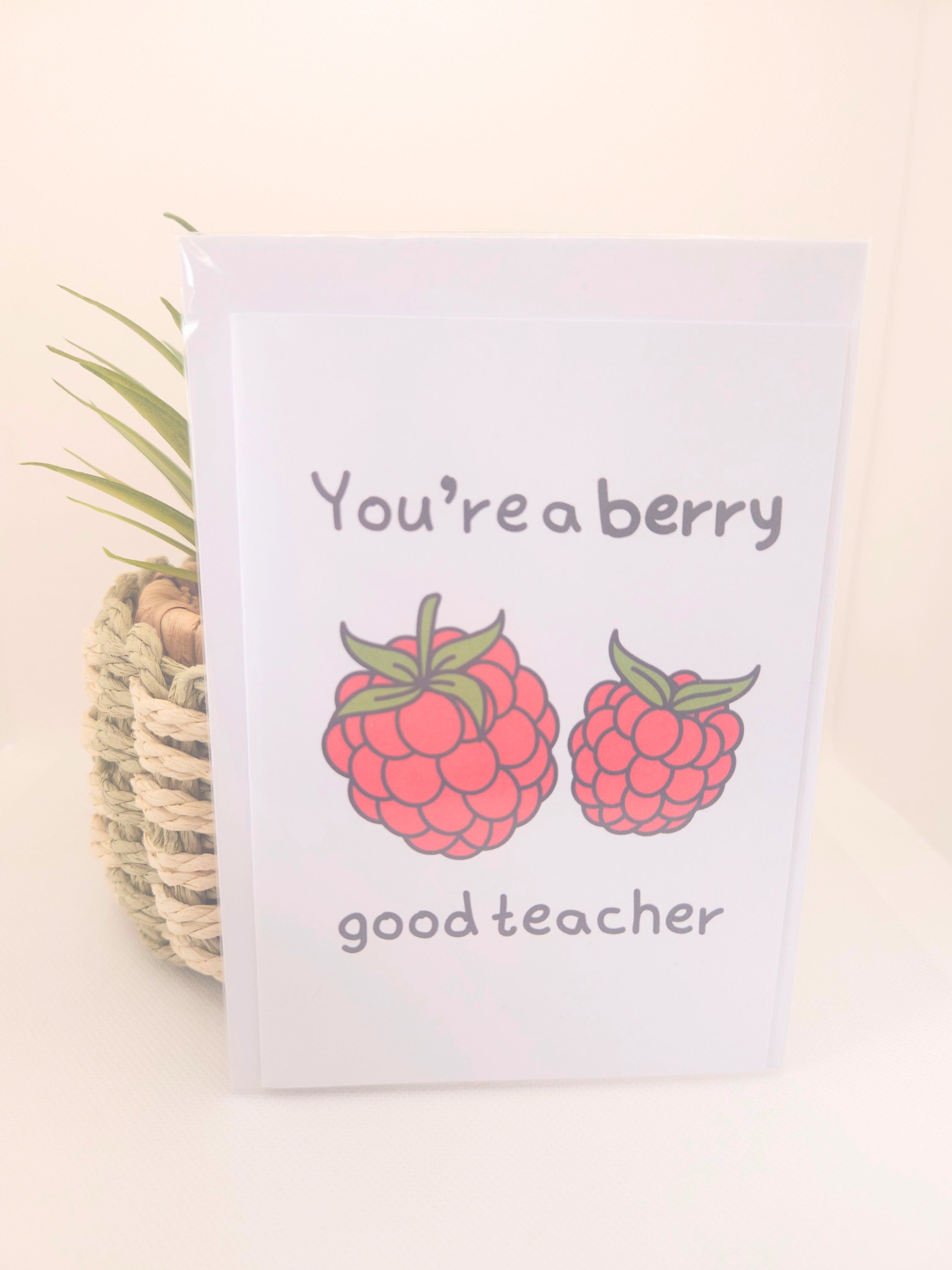 Card with raspberries and text 'You're a berry good teacher' on a light background