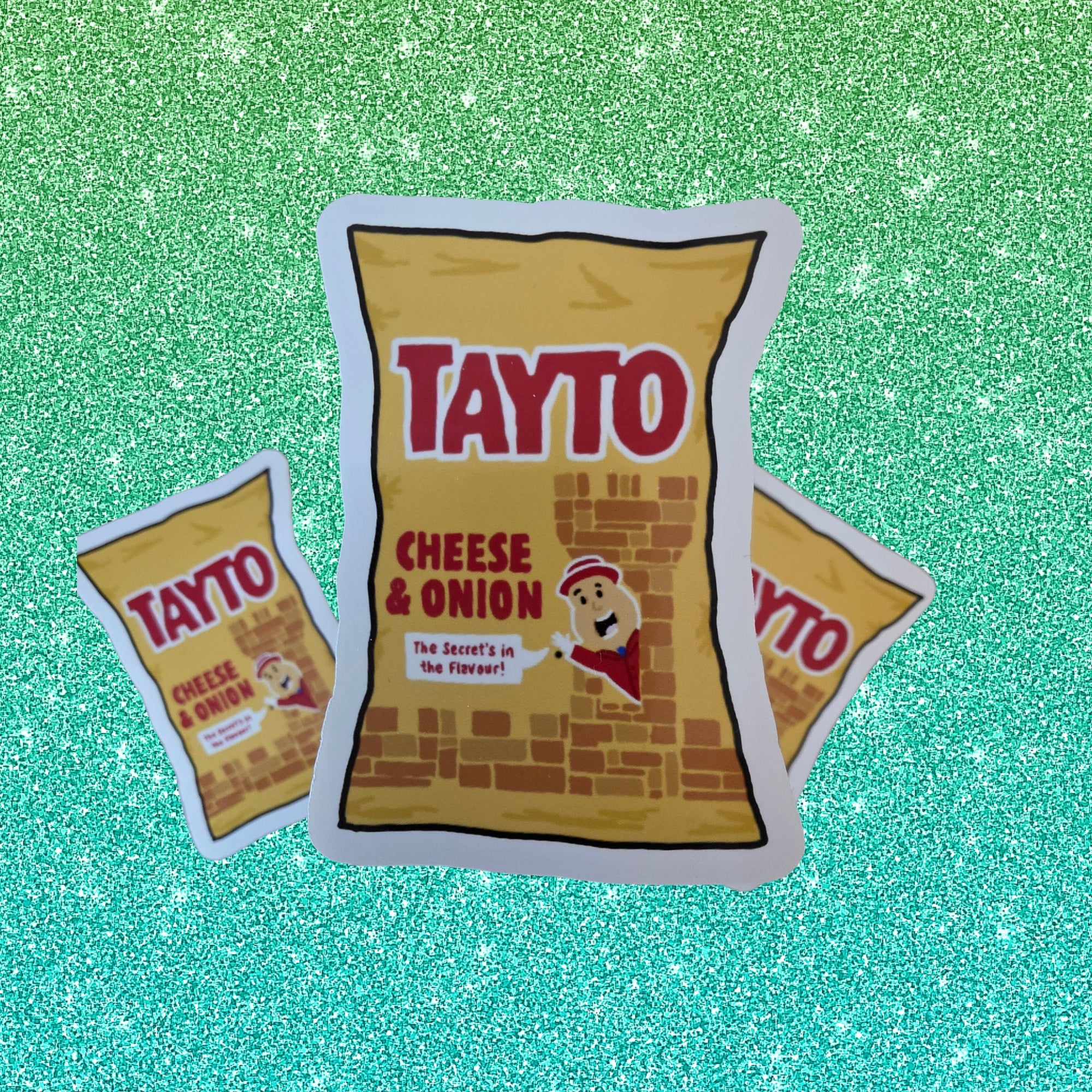 yellow crisp packet stickers on a green glittery background
