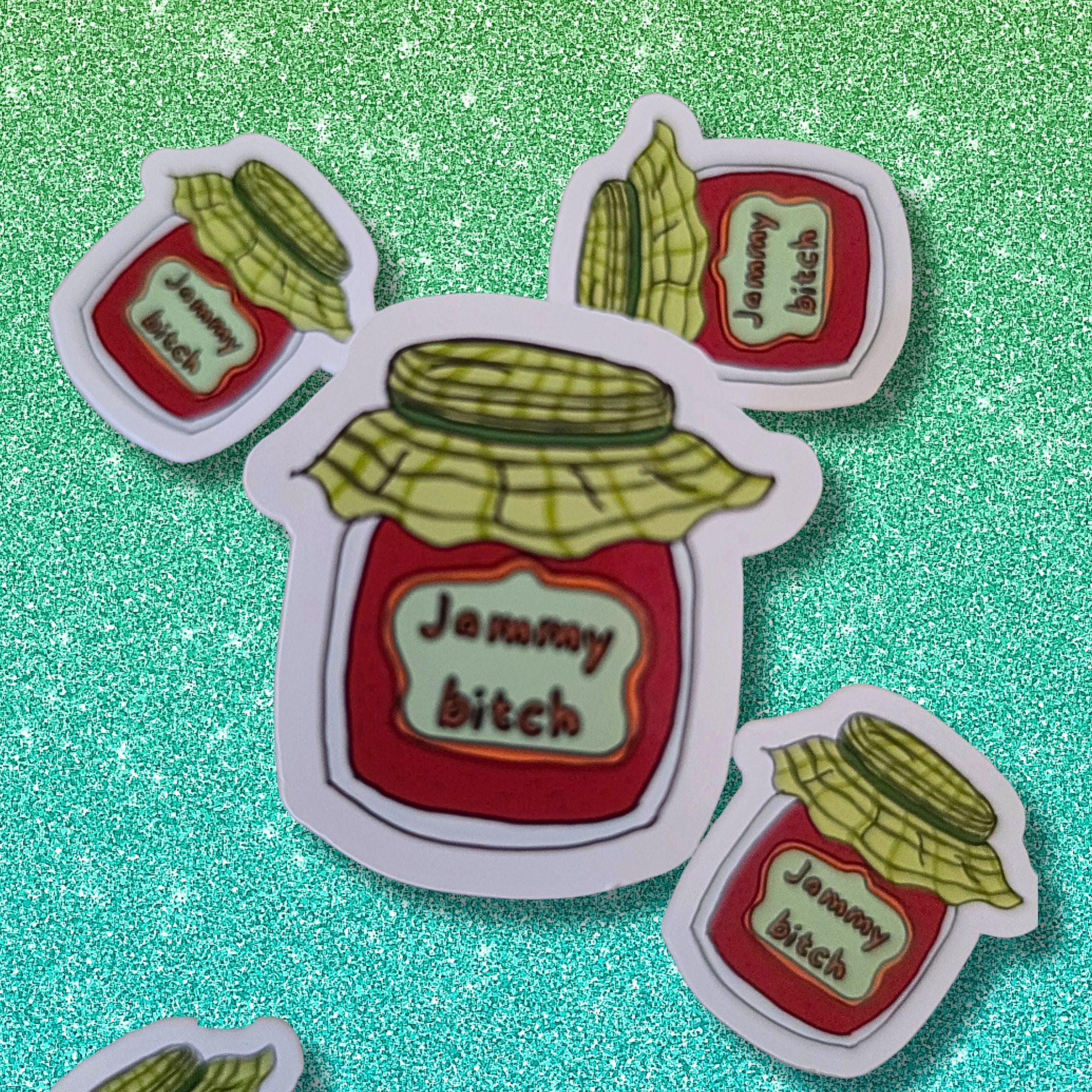 die cut sticker of a jam jar saying jammy bitch