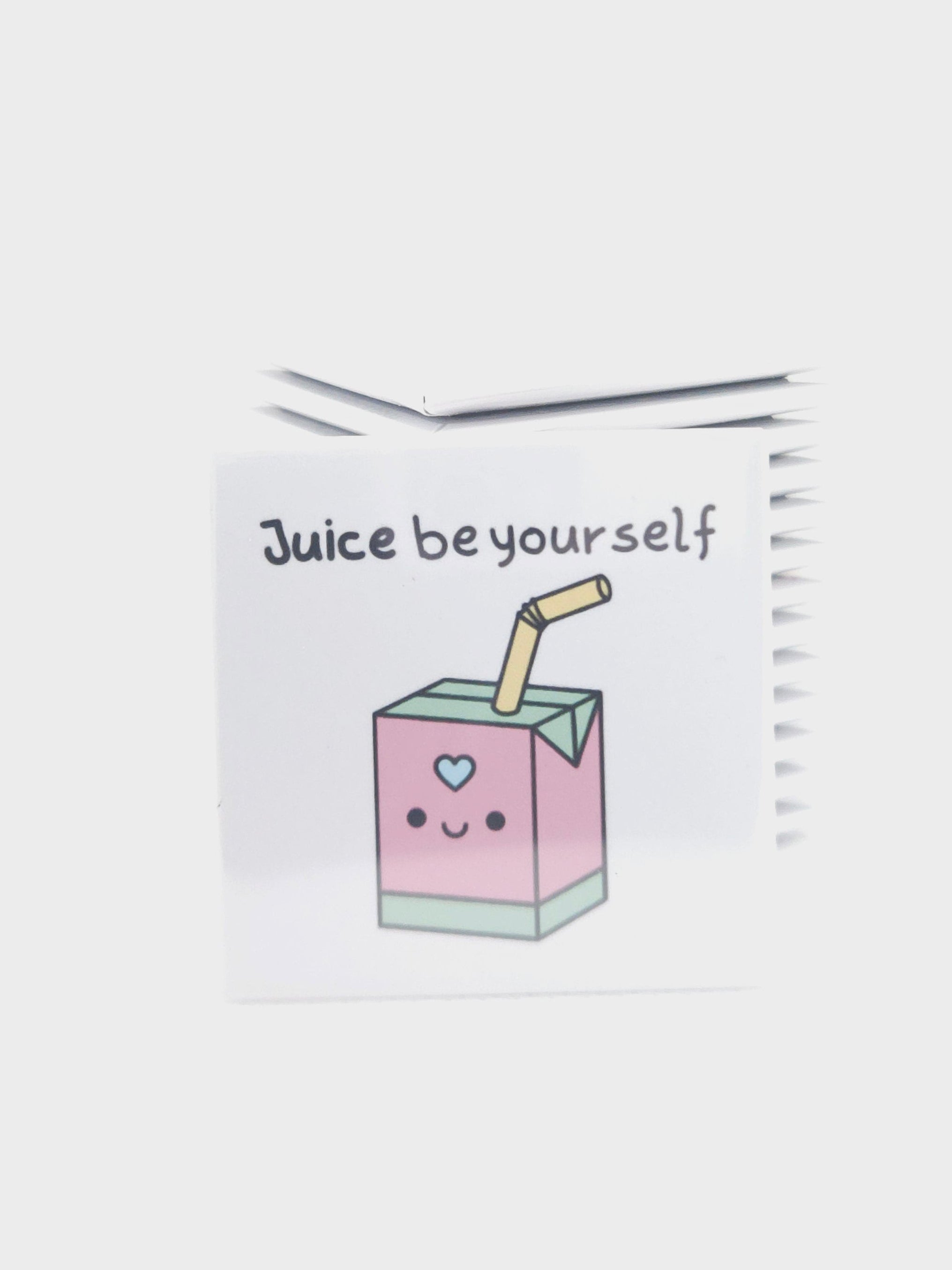 magnet with a cartoon juice box and text on a white background