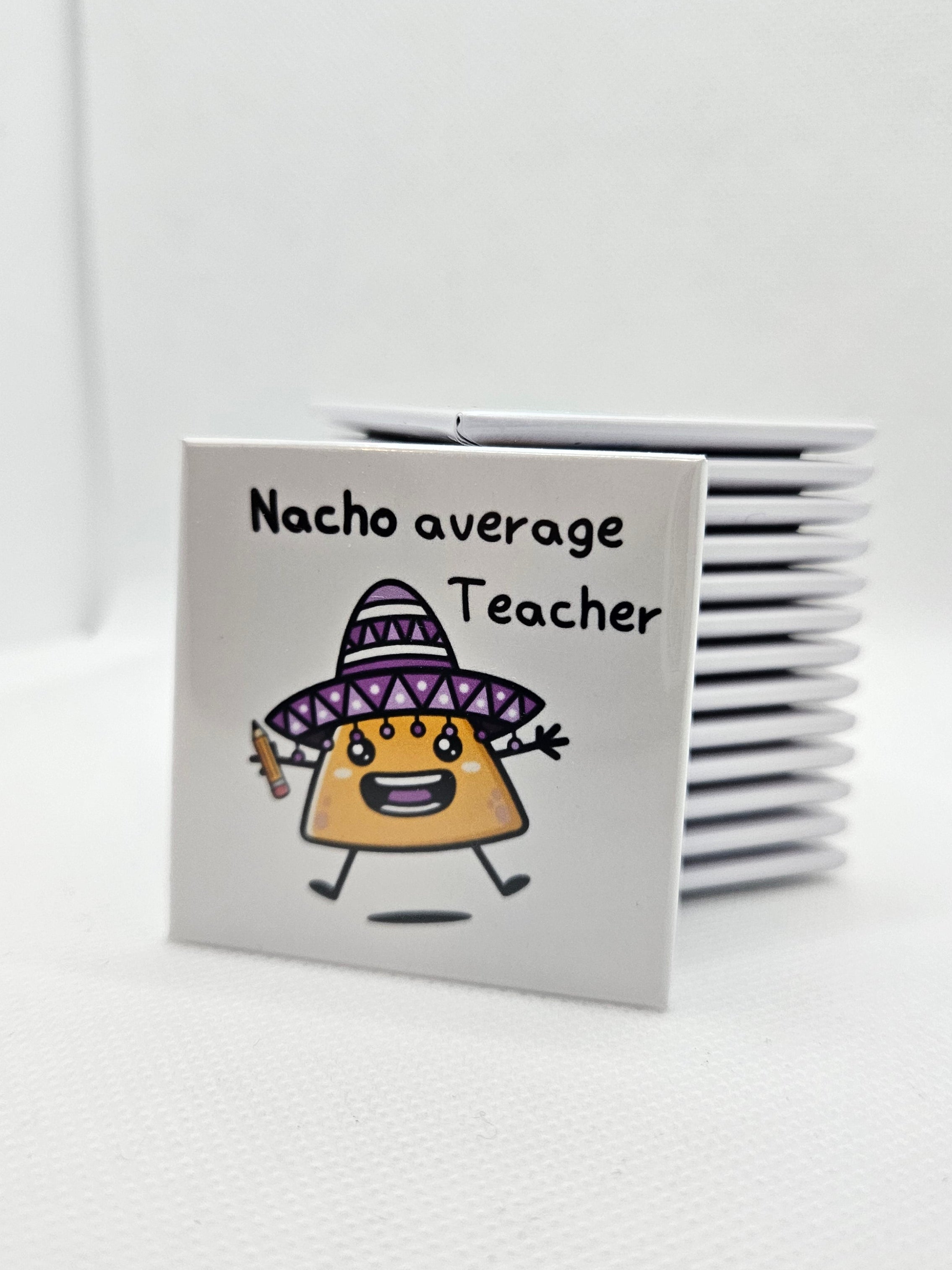 magnet with a humourous image of a nacho holding a pencil