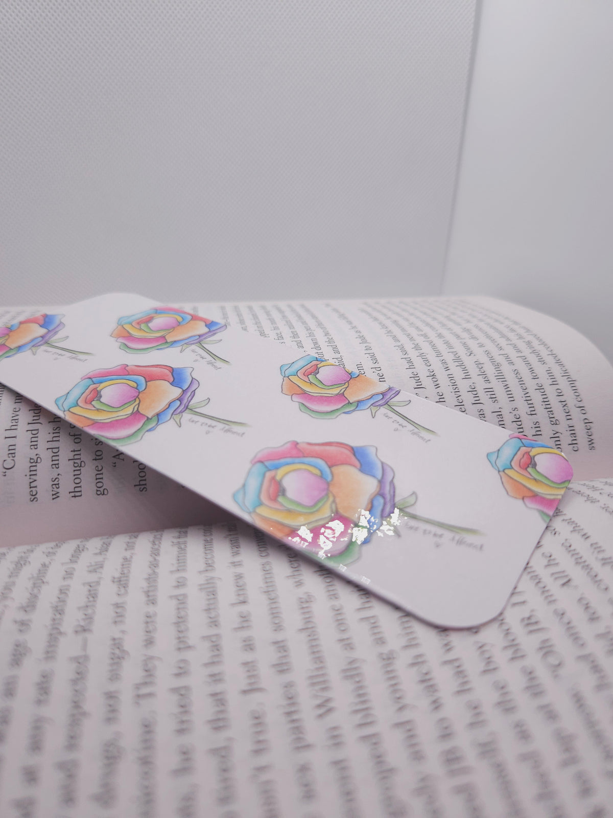 handmade bookmark with colorful designs on an open book