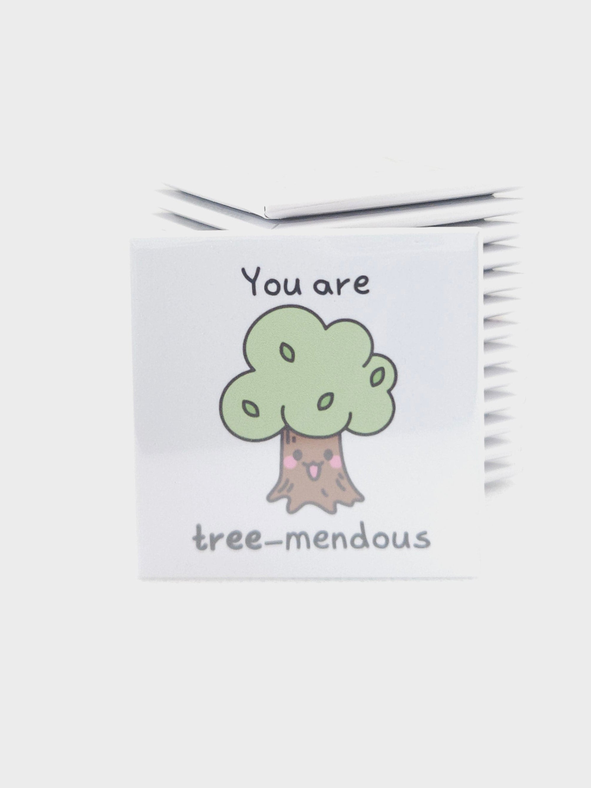magnet with a tree-themed design on a white background
