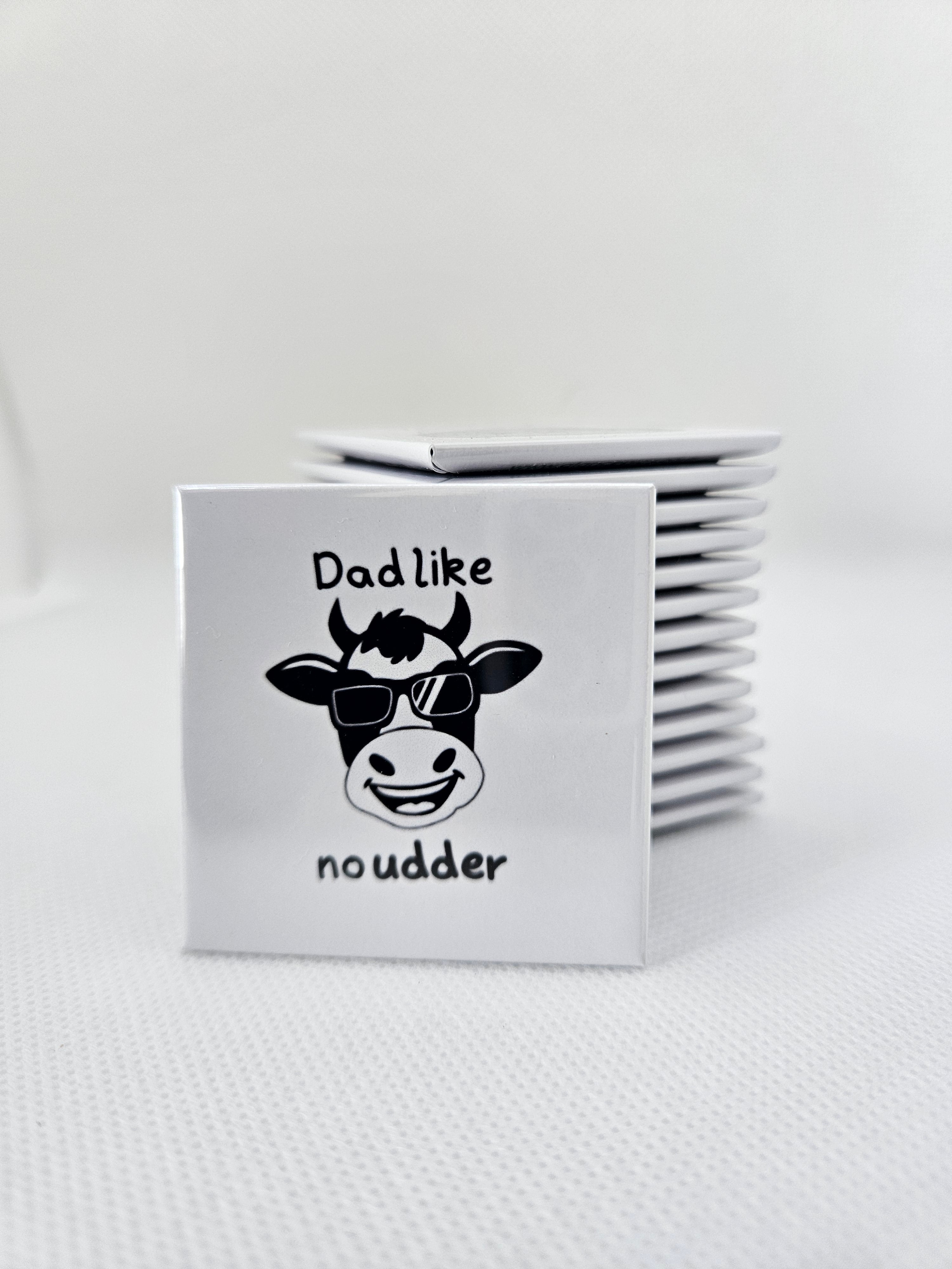 magnet with black cow with sunglasses and text on a white background
