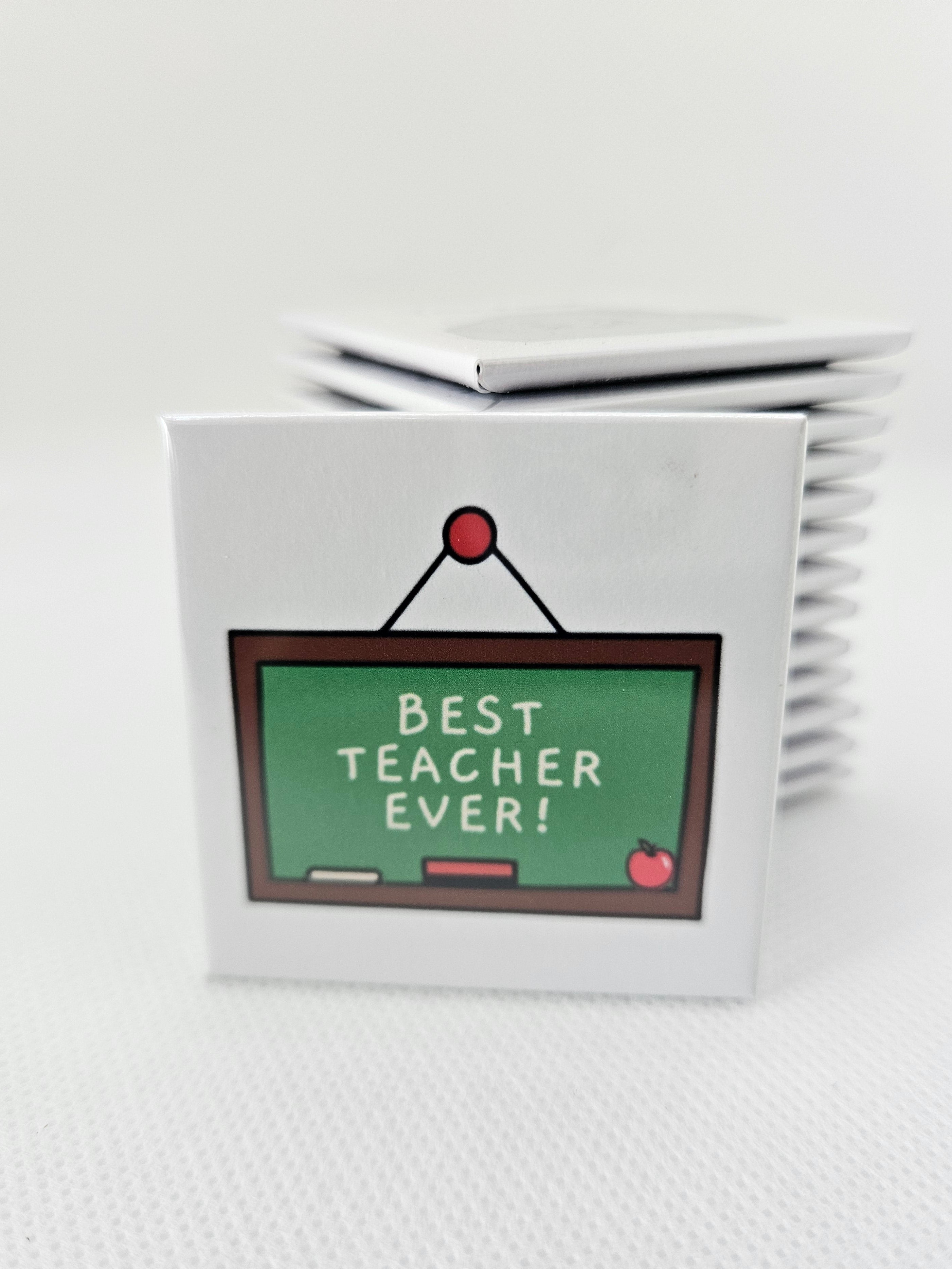 magnet with a chalkboard design and 'Best Teacher Ever!' text on a white textured surface.