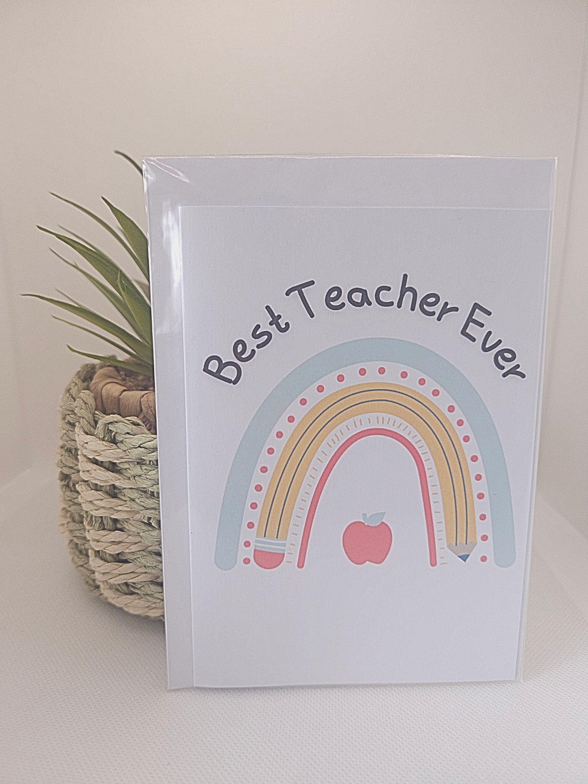 Card with rainbow design and 'Best Teacher Ever' text on a white background