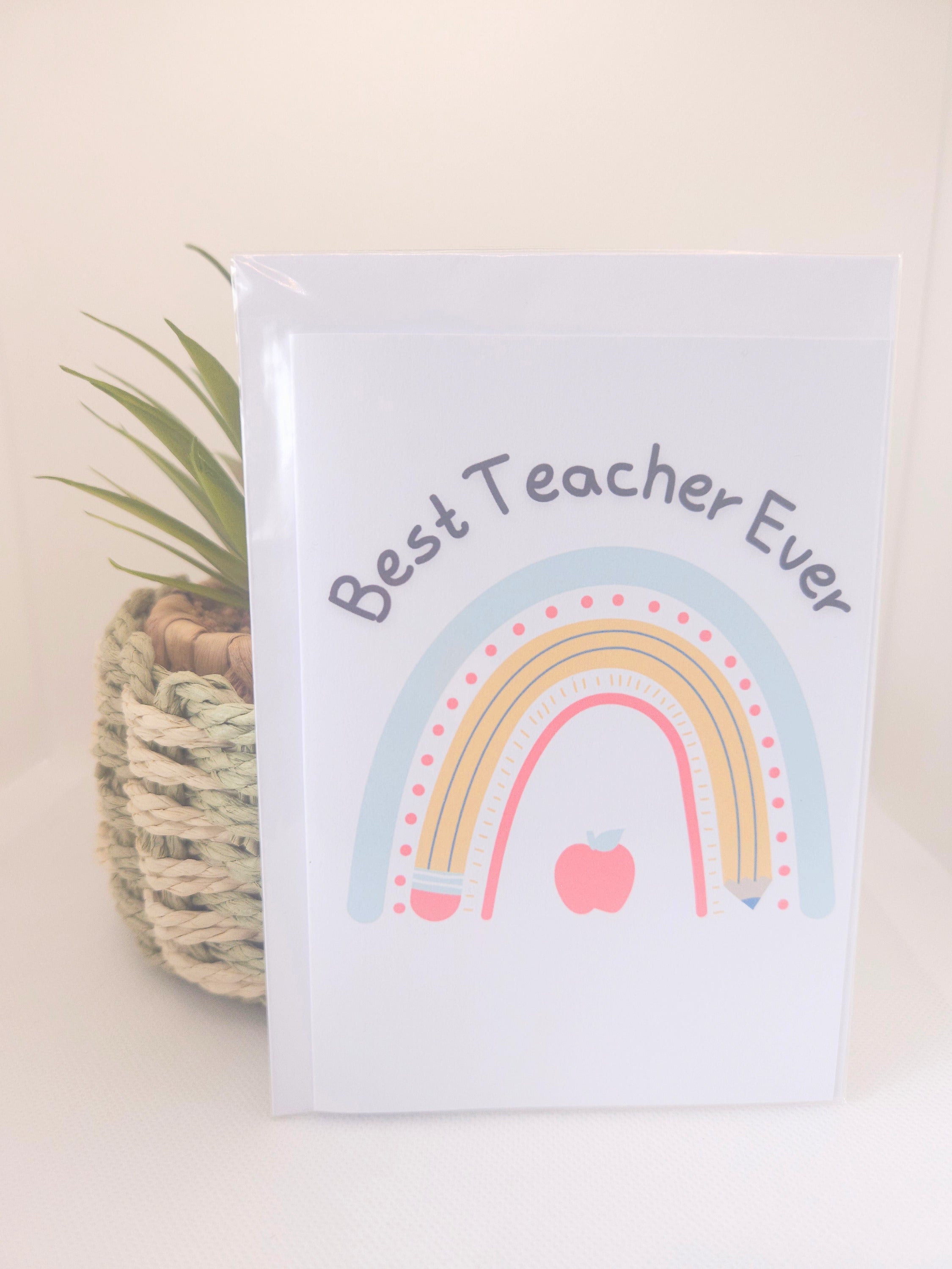 Card with rainbow design and 'Best Teacher Ever' text on a white background