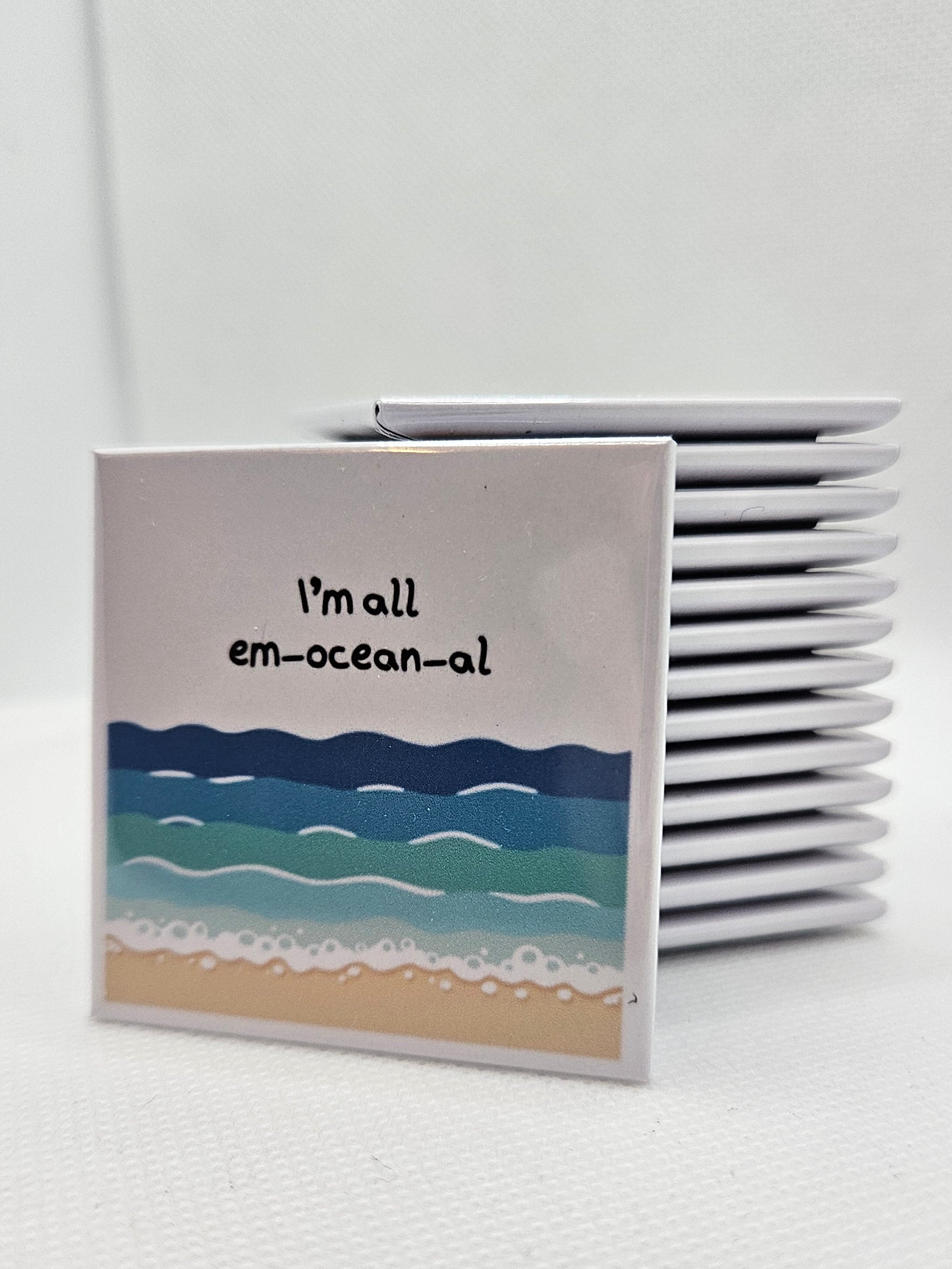 illustrated ocean, beach and waves with words "i'm all emoceanal"