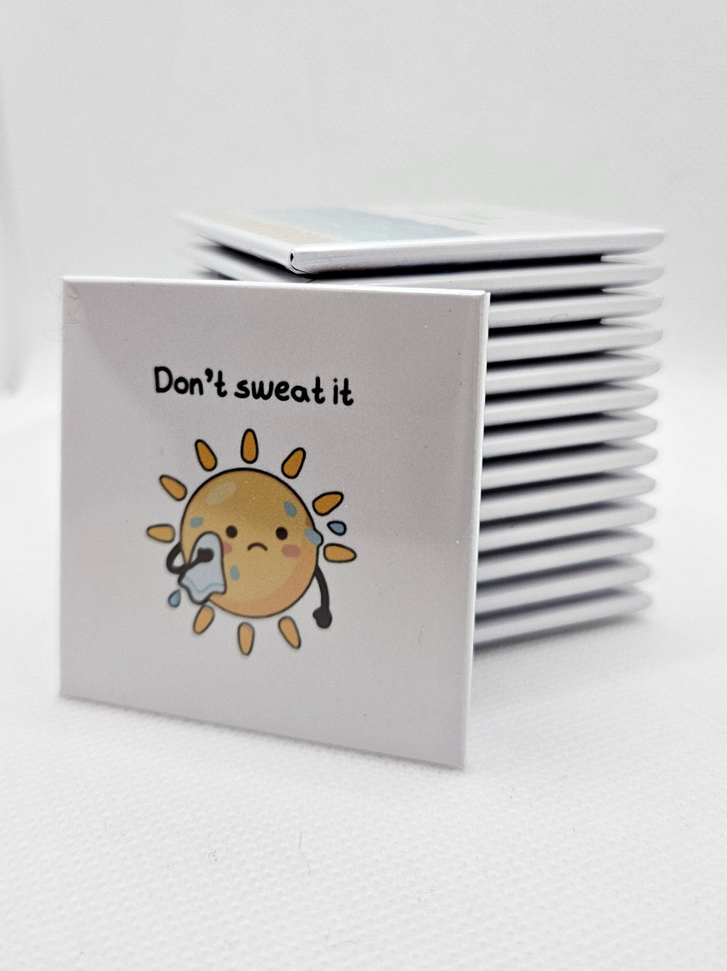 cartoon sun sweating with text on a white background "don't sweat it"