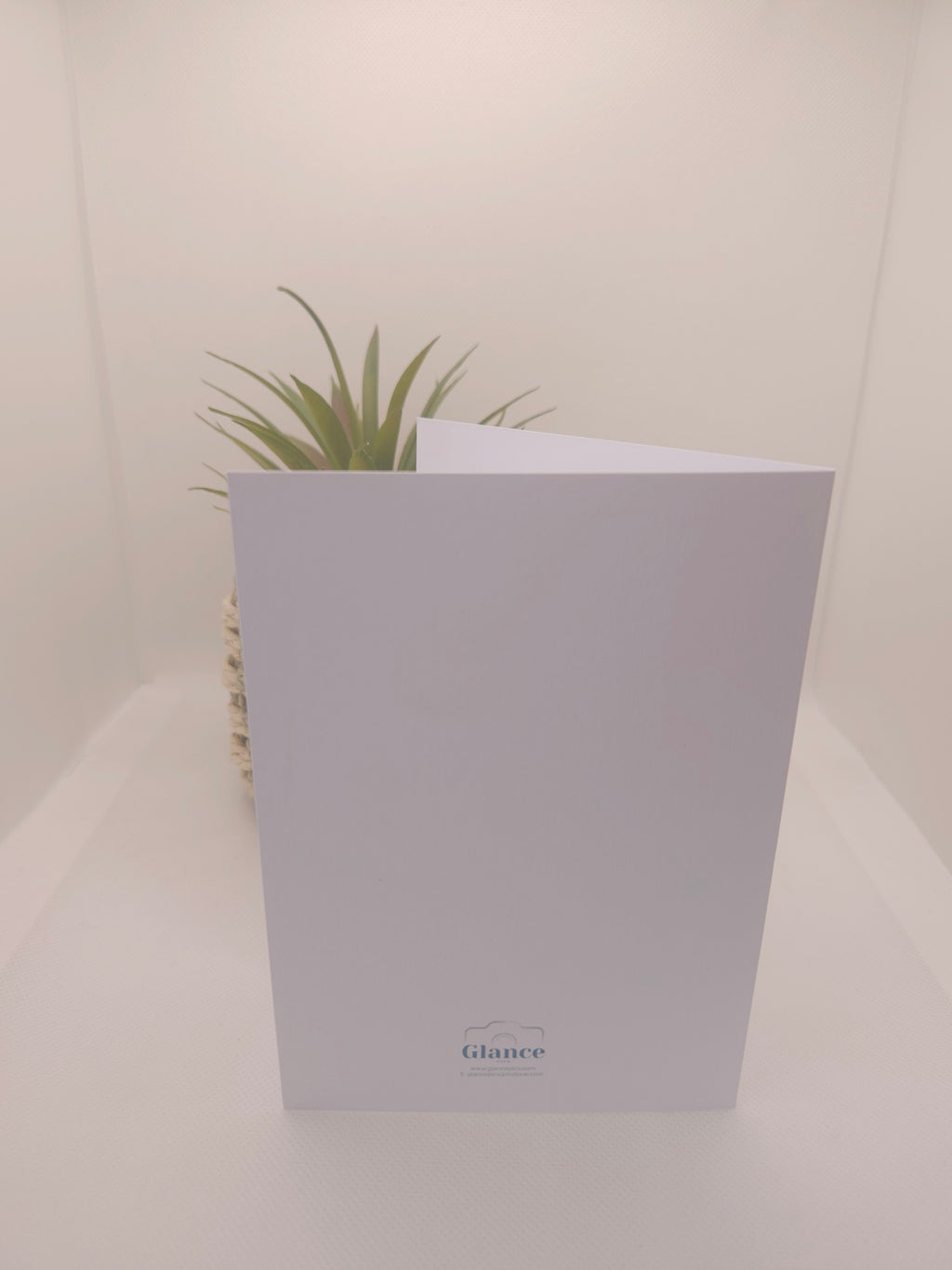 back of a white greeeting card with a Glance Pics logo