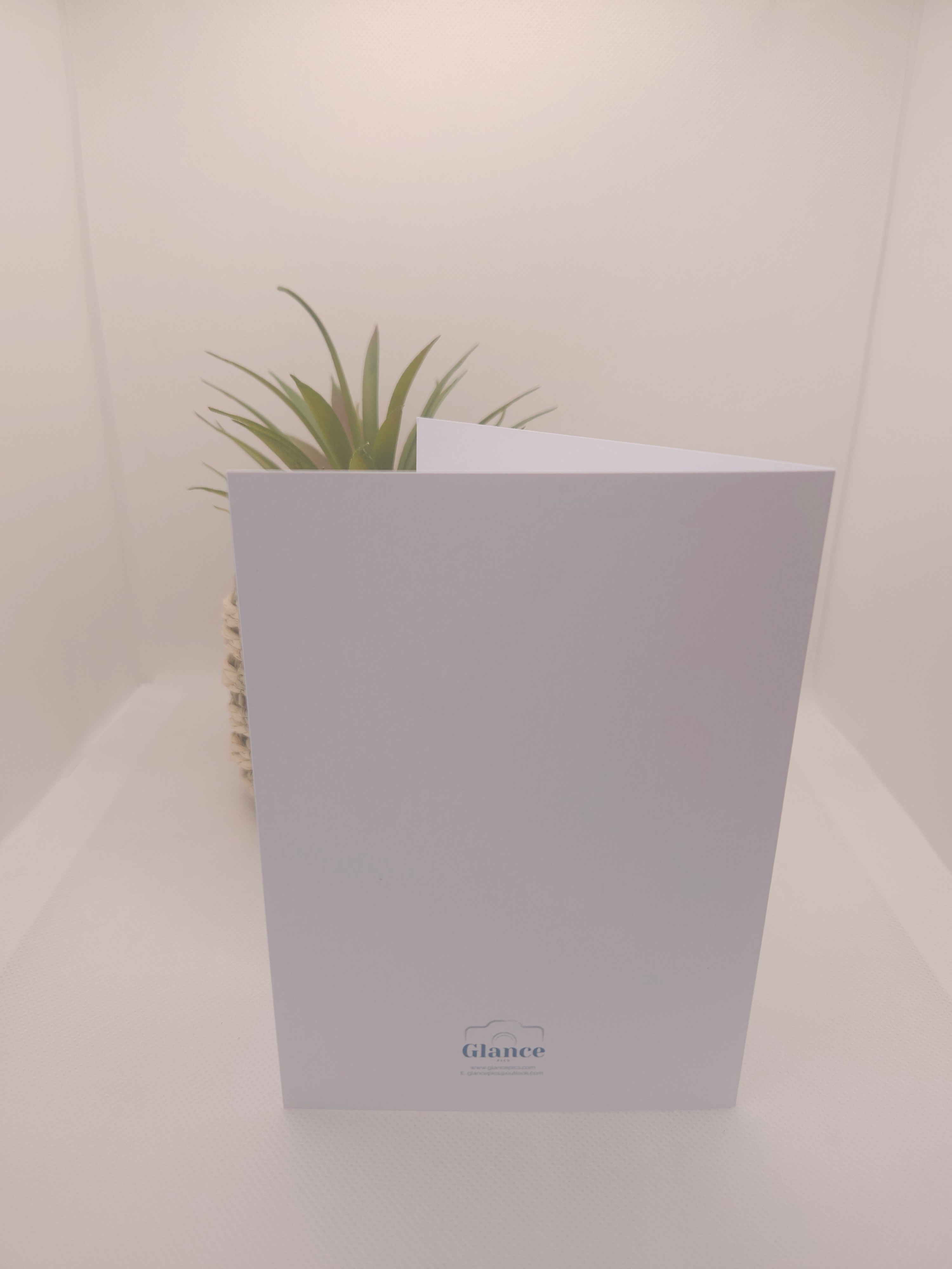back of a white greeeting card with a Glance Pics logo