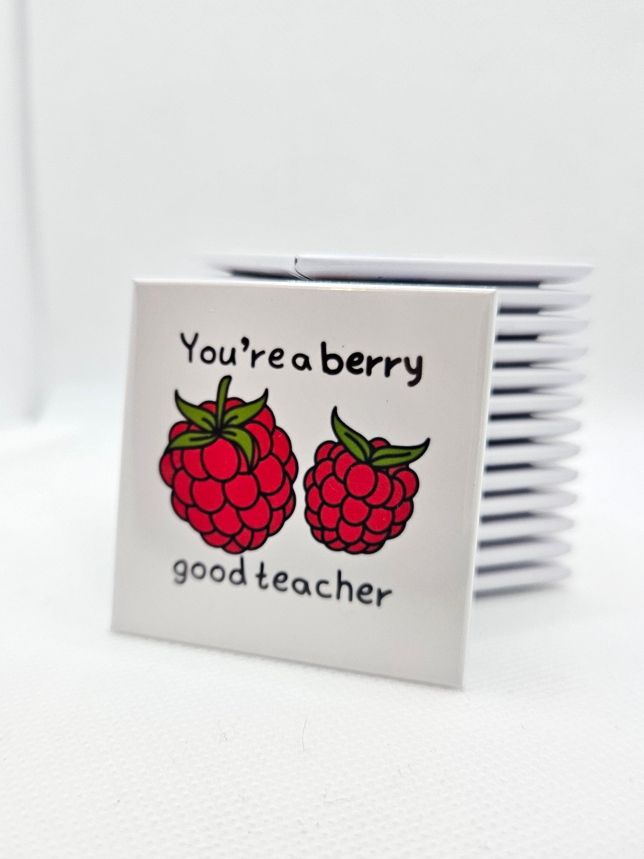 magnet with 'You're a berry good teacher' text and raspberry design on a white background