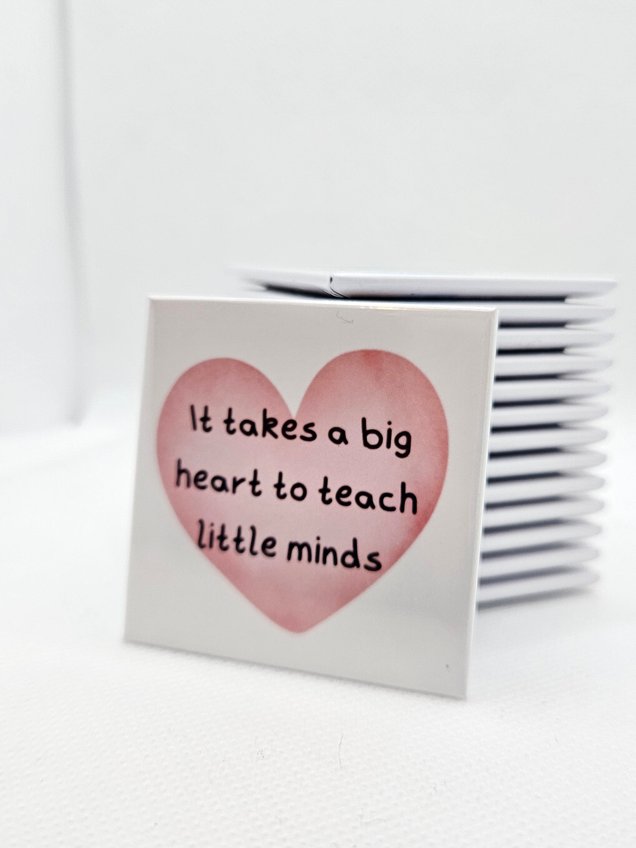 magnet with a heart design and text on a white background