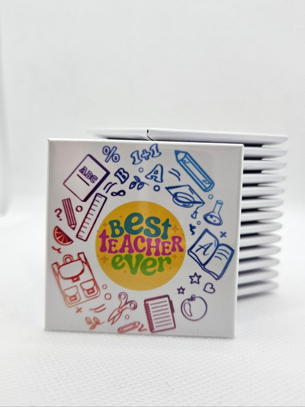 magnet with colourful pens and books with 'Best Teacher Ever' design on a white background