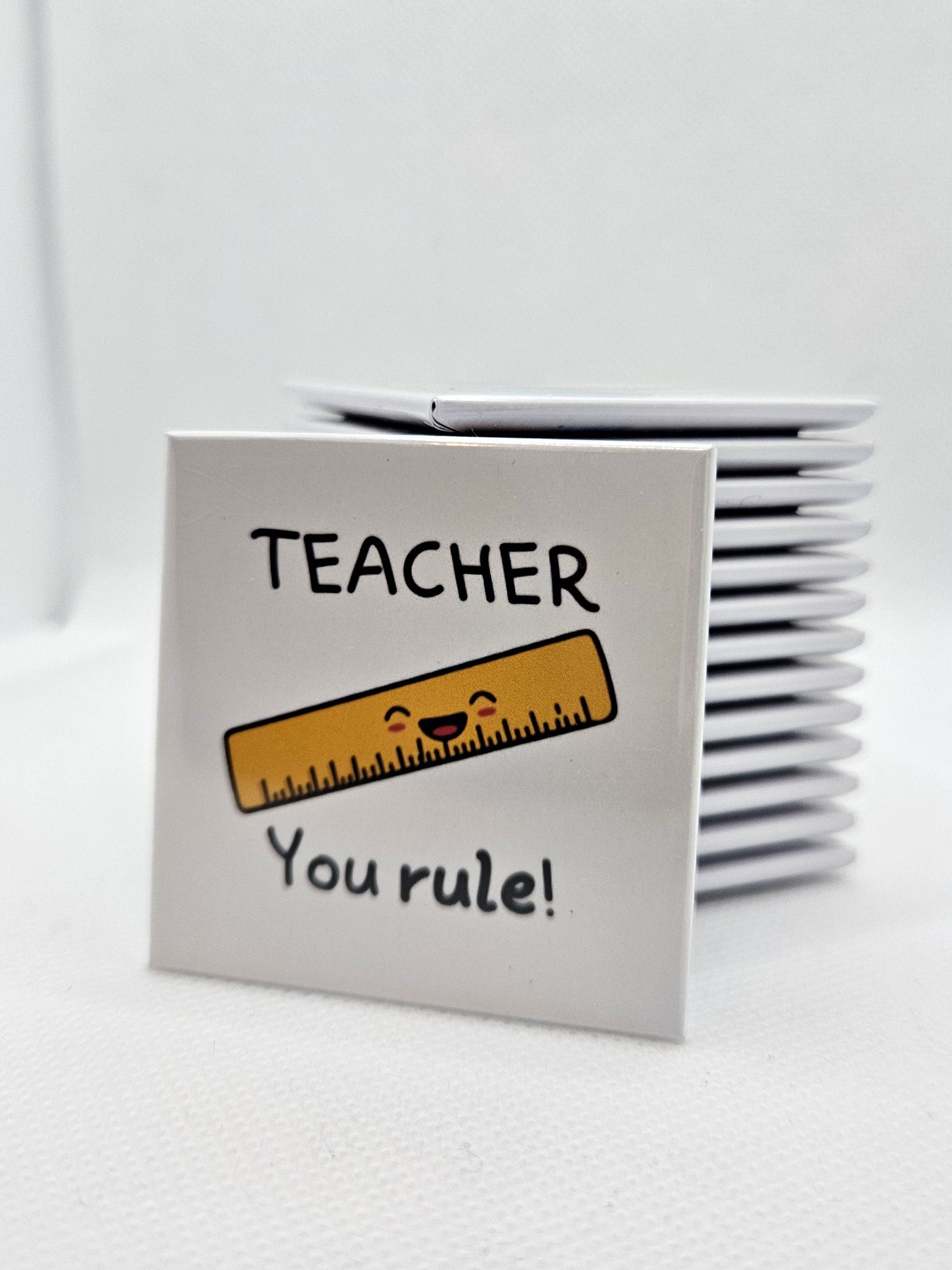 magnet with a ruler design and text on a white background
