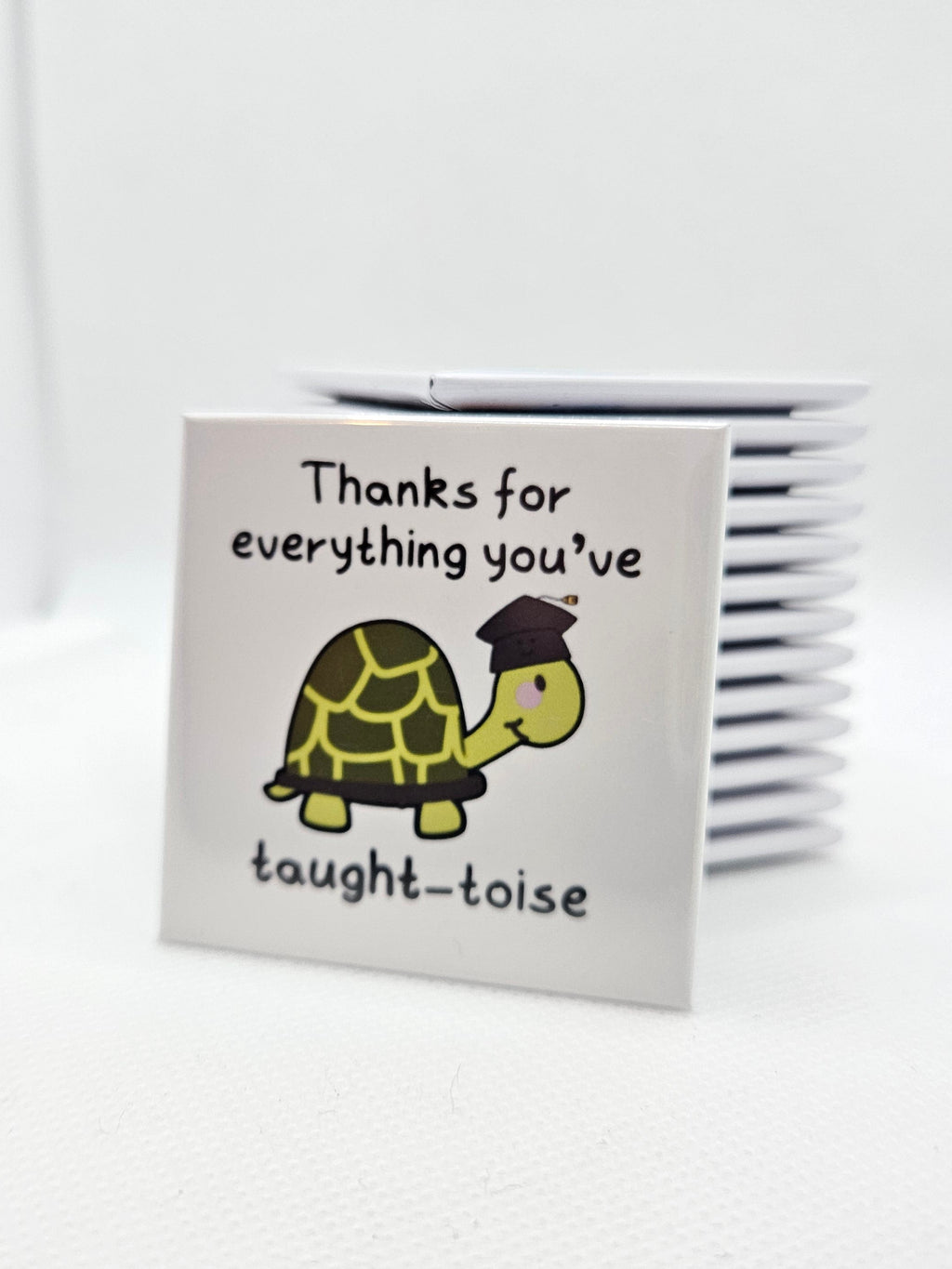 Small magnet with a turtle illustration and text on a white background
