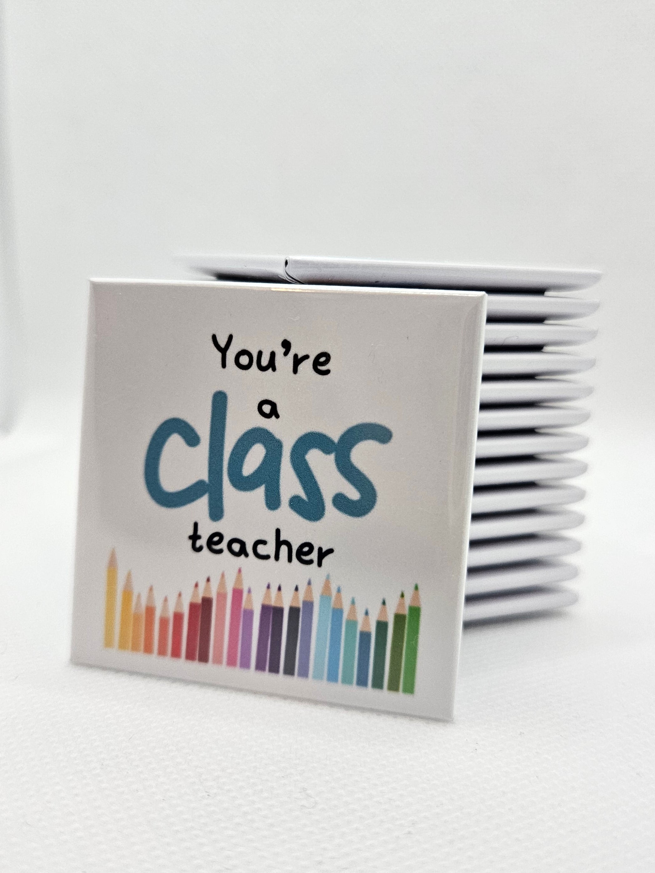 magnet with colorful pencil illustrations and text on a white background