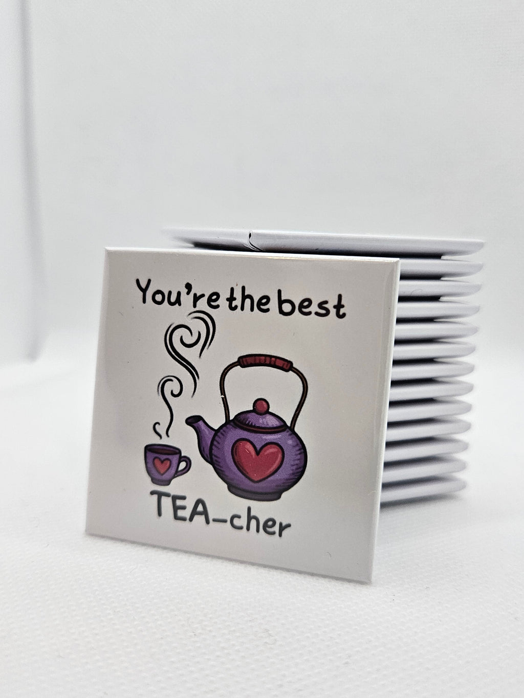 Teacher tea themed magnet with decorative text on a white background