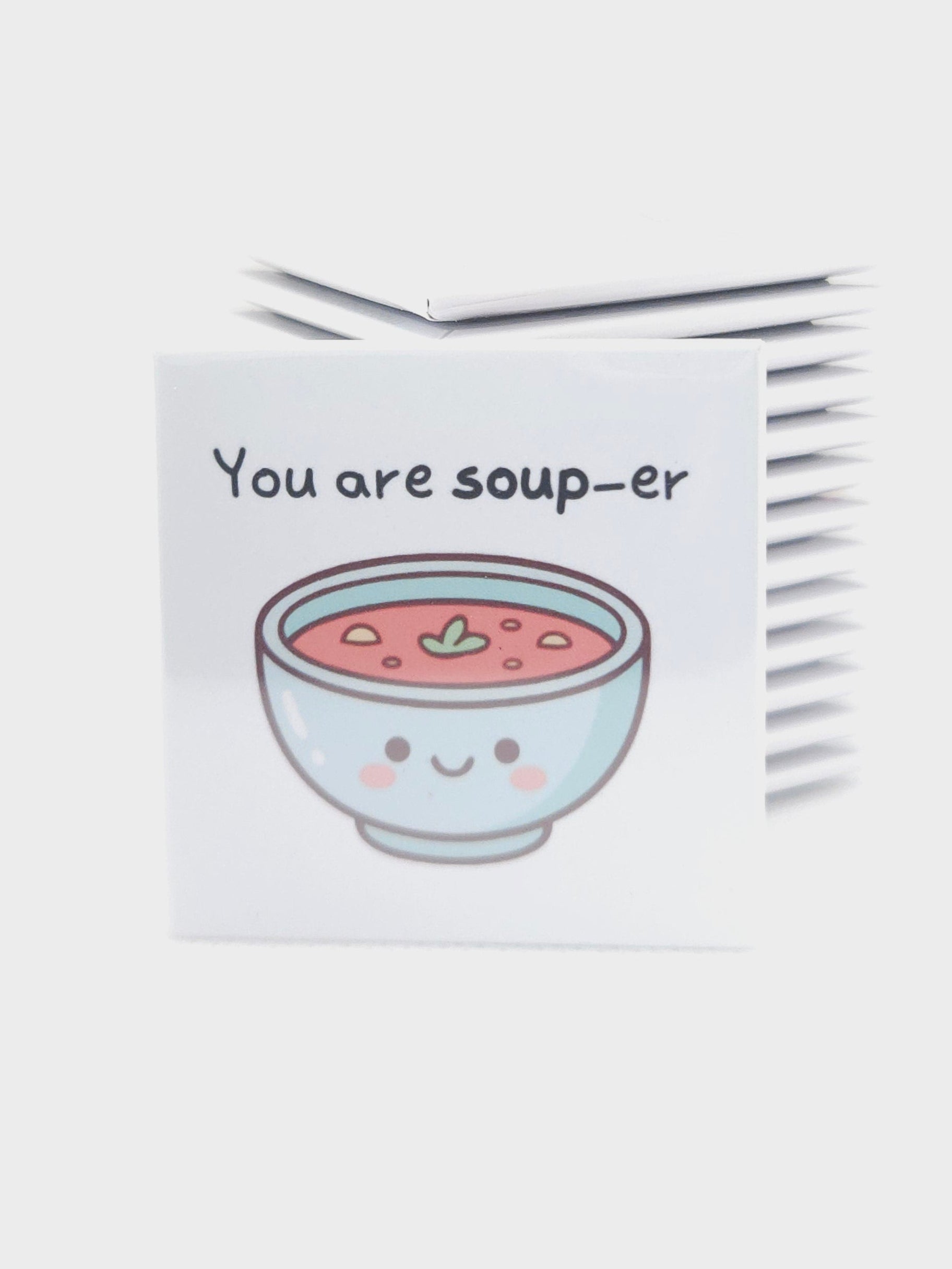 magnet with a cartoon illustration of a bowl and text on a white background