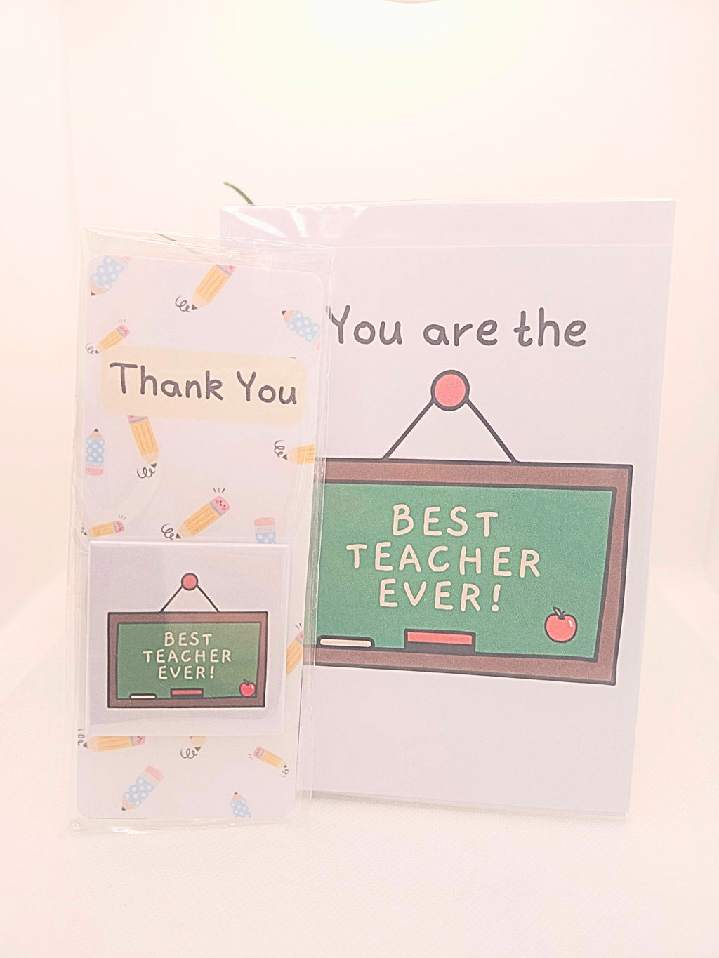 chalkboard with the words best teacher ever on a card, magnet and bookmark