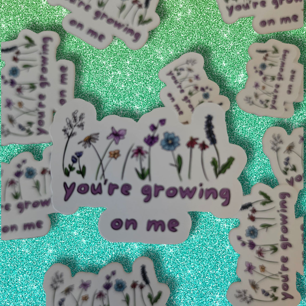 die cut flowery sticker with the words you're growing on me